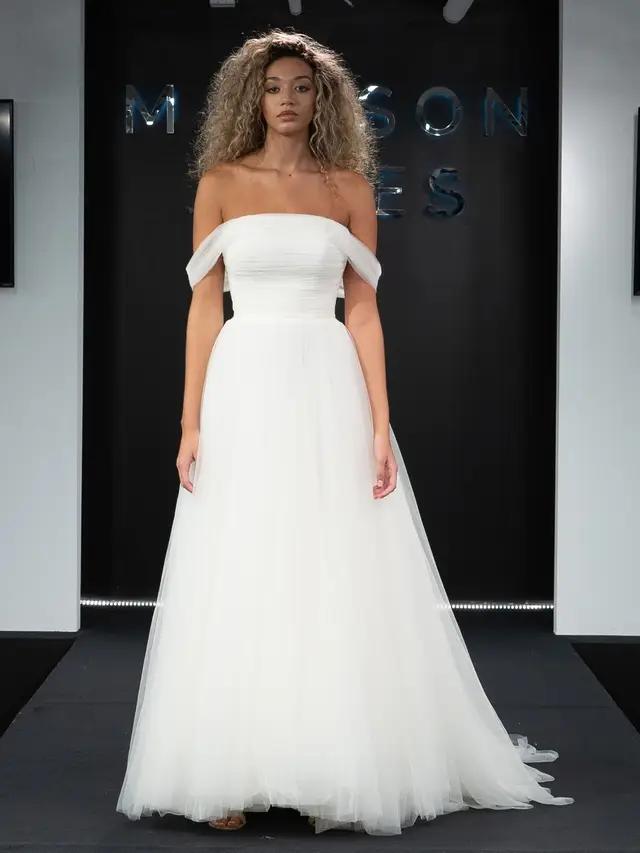 Model wearing a white gown 4